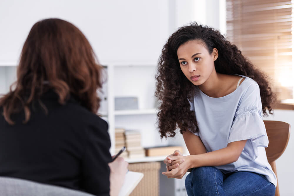 Woman receiving OCD therapy through onsite mental health consultation