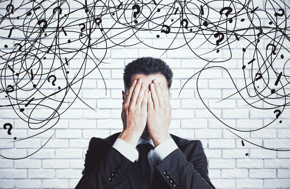 Person covering ears symbolizing auditory hallucinations and psychotic symptoms of schizoaffective disorder