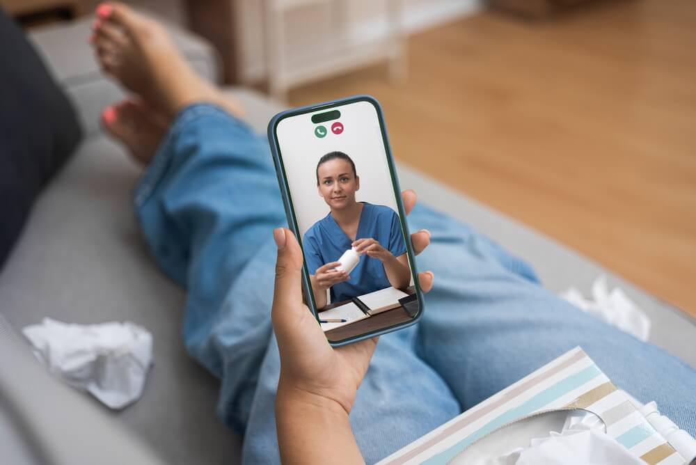 Patient attending virtual telepsychiatry appointment on laptop for schizoaffective disorder treatment