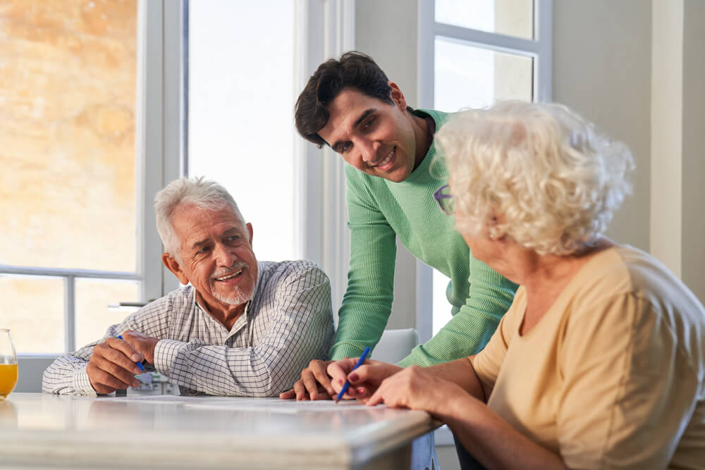 Group cognitive stimulation therapy session helping seniors with dementia improve memory