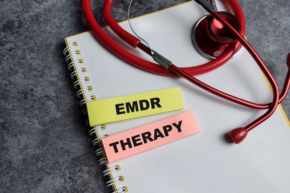 therapist helps patient through EMDR eye movement therapy for PTSD treatment