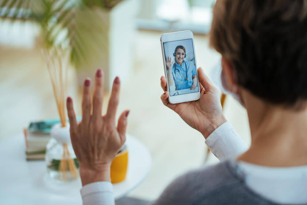 Psychiatrist consulting a patient through secure telehealth video platform
