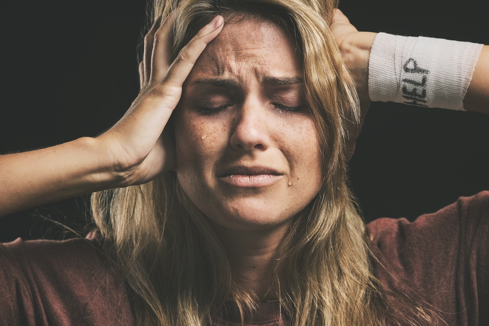 Woman appearing calm externally while struggling internally with hidden PTSD symptoms