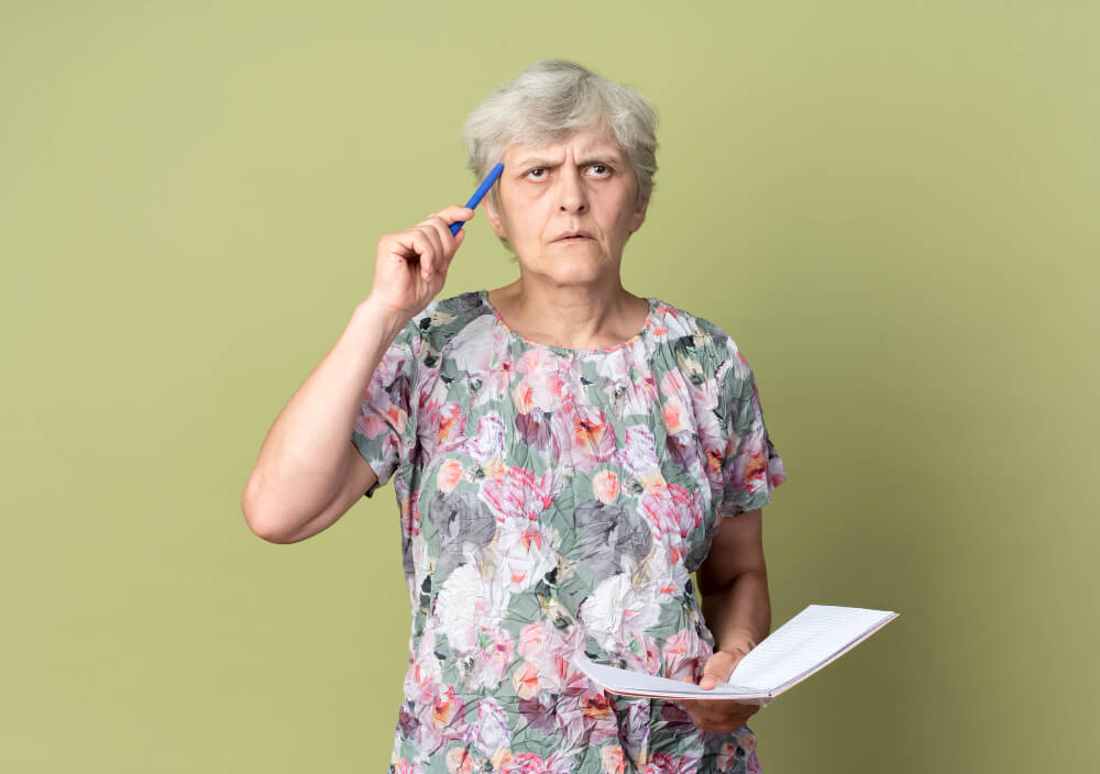 Dementia in women showing memory loss and cognitive decline in elderly female